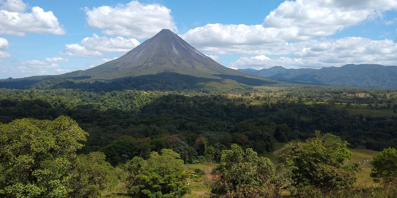 Arenal Volcano above forest in Costa Rica